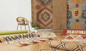 how to choose and style a rug on brown carpet.