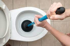 when to call a plumber for a clogged toilet